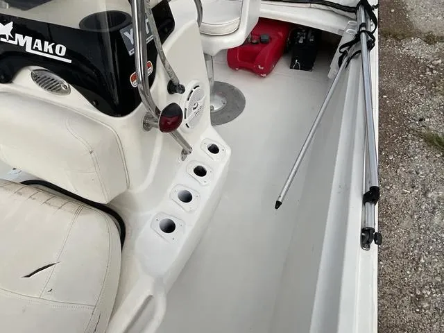 Slide: The Image of 2012 Mako Pro Skiff interior with seating, rod holders, and storage. - 10