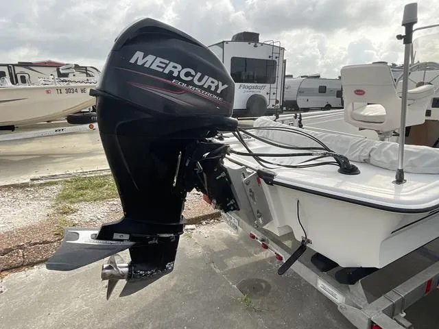 Slide: The Image of 2012 Mako Pro Skiff with Mercury outboard motor on a trailer. - 6