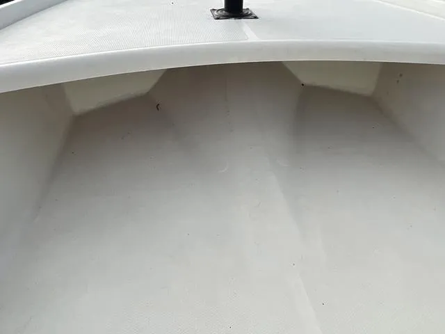 Slide: The Image of 2012 Mako Pro Skiff boat interior, showcasing clean, white deck space. - 8