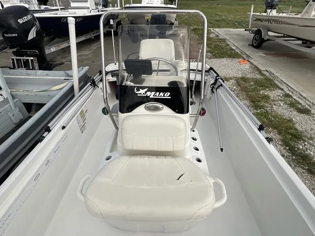 Slide: The Image of 2012 Mako Pro Skiff boat interior with steering console and seating. - 9