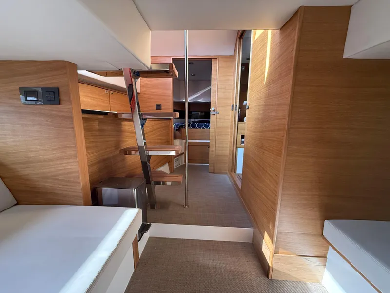 Slide: The Image of Interior of 2021 De Antonio Yachts D42, featuring modern wood finishes and sleek design. - 22