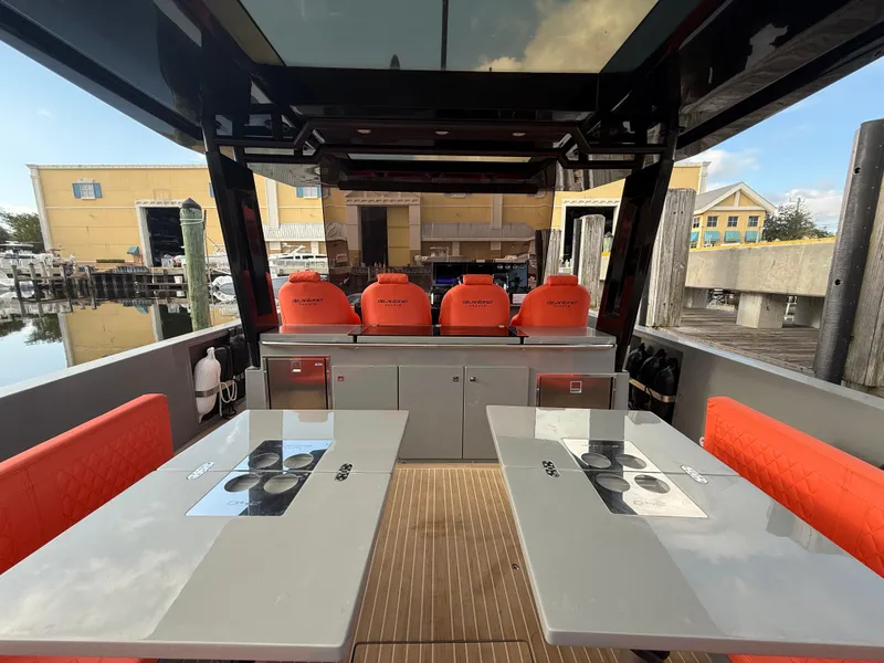 Slide: The Image of Interior view of 2021 De Antonio Yachts D42 with modern seating and tables. - 5