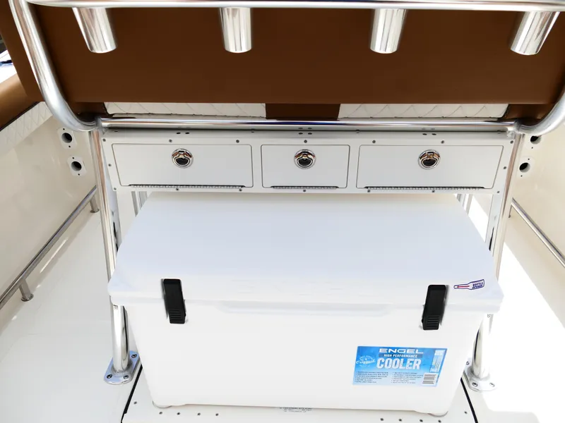 Slide: The Image of 2026 Pioneer 202 Islander boat interior with storage drawers and Engel cooler. - 18