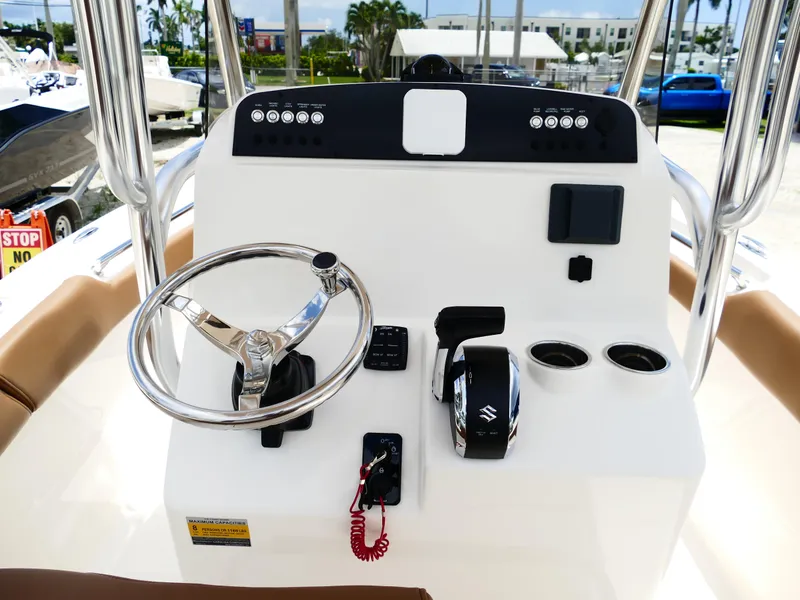 Slide: The Image of 2026 Pioneer 202 Islander boat console with steering wheel and controls. - 20