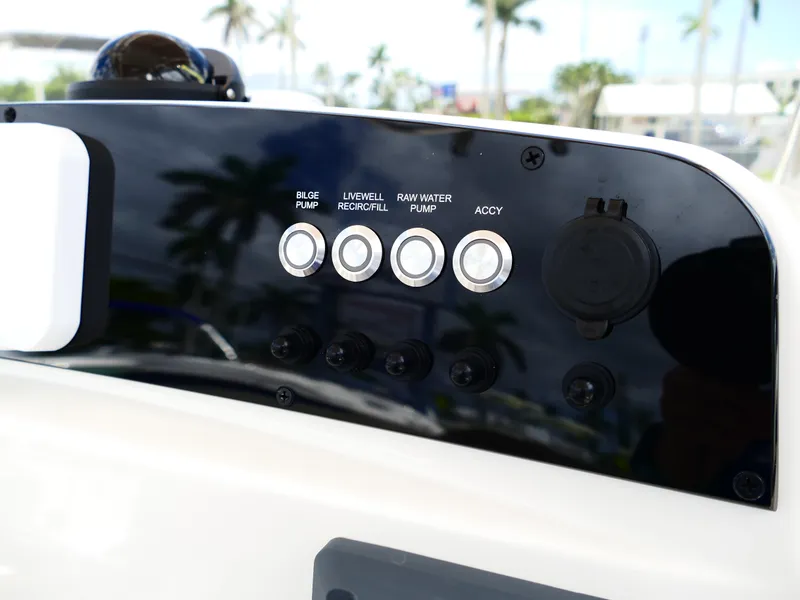 Slide: The Image of Control panel of 2026 Pioneer 202 Islander boat with pump switches. - 24