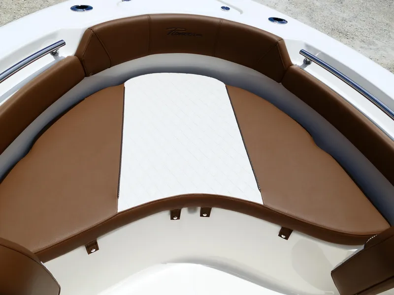 Slide: The Image of 2026 Pioneer 202 Islander boat with brown and white cushioned seating. - 33