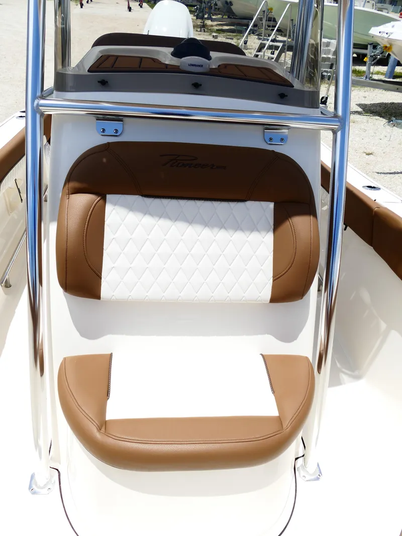 Slide: The Image of 2026 Pioneer 202 Islander boat seat with brown and white upholstery, featuring diamond stitching. - 41