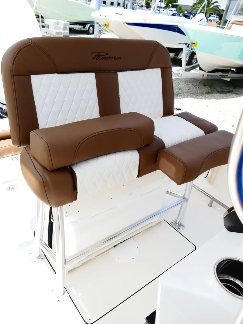 Slide: The Image of 2026 Pioneer 202 Islander boat seat, brown and white upholstery, outdoor setting. - 46