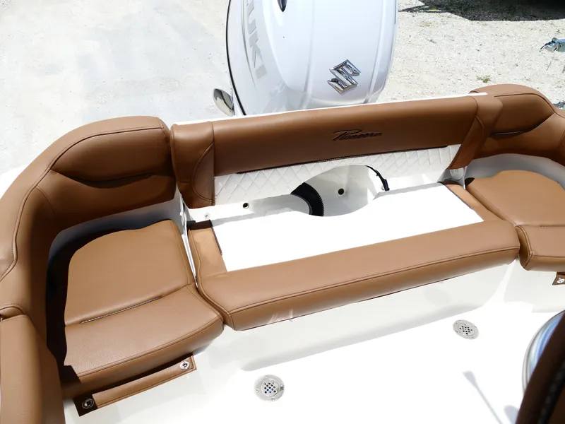 Slide: The Image of 2026 Pioneer 202 Islander boat with brown leather seating and Suzuki engine. - 48