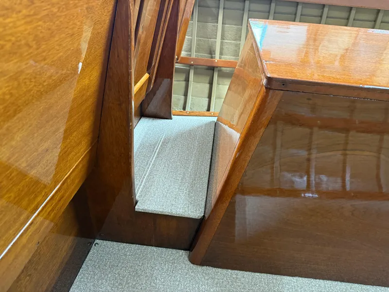 Slide: The Image of Interior of a 1955 Lyman 18 Inboard boat with polished wooden surfaces. - 10