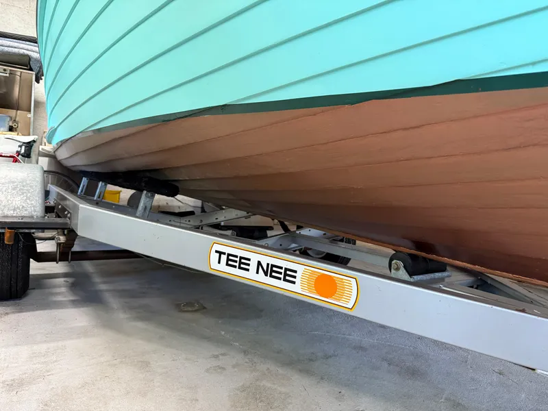 Slide: The Image of 1955 Lyman 18 Inboard boat on Tee Nee trailer in garage. - 16