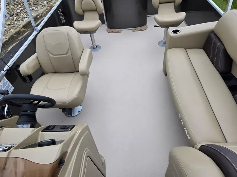 Slide: The Image of 2022 Sylvan Mirage Fish 822 Party Fish interior with beige seating and steering console. - 16
