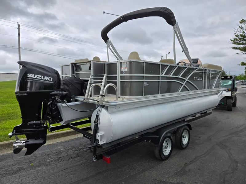Slide: The Image of 2022 Sylvan Mirage Fish 822 Party Fish pontoon boat on trailer, featuring Suzuki outboard motor. - 3