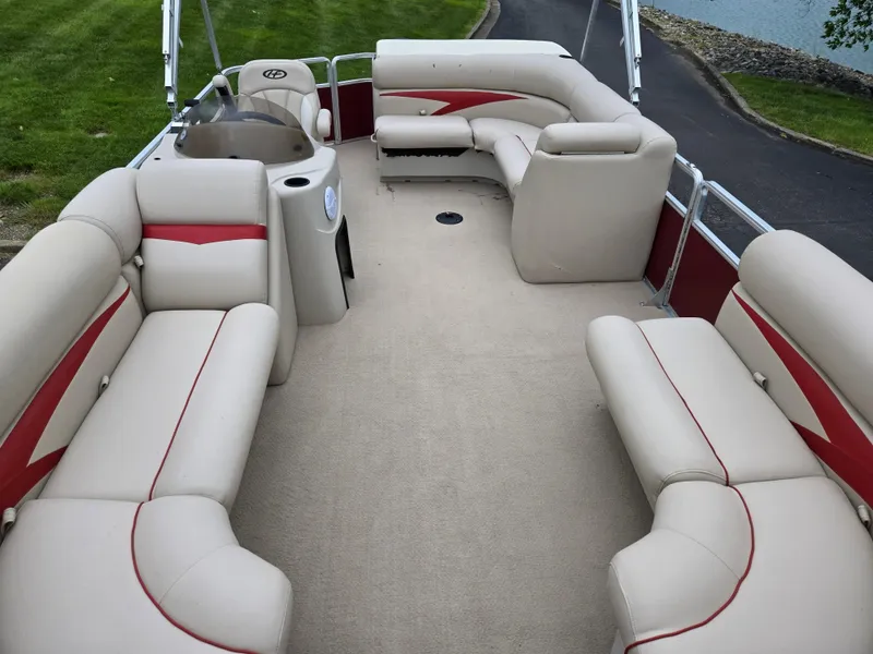 Slide: The Image of 2010 Harris FloteBote 200 Cruiser CX pontoon boat with beige and red seating. - 11