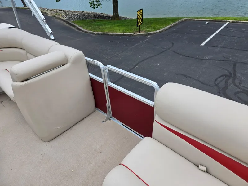 Slide: The Image of 2010 Harris FloteBote 200 Cruiser CX pontoon boat with beige seating and red accents. - 12