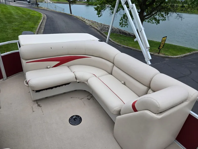 Slide: The Image of 2010 Harris FloteBote 200 Cruiser CX pontoon boat with beige seating and red accents. - 14