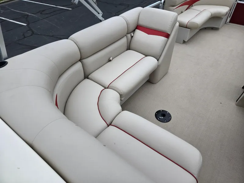 Slide: The Image of 2010 Harris FloteBote 200 Cruiser CX interior with beige seating and red accents. - 19