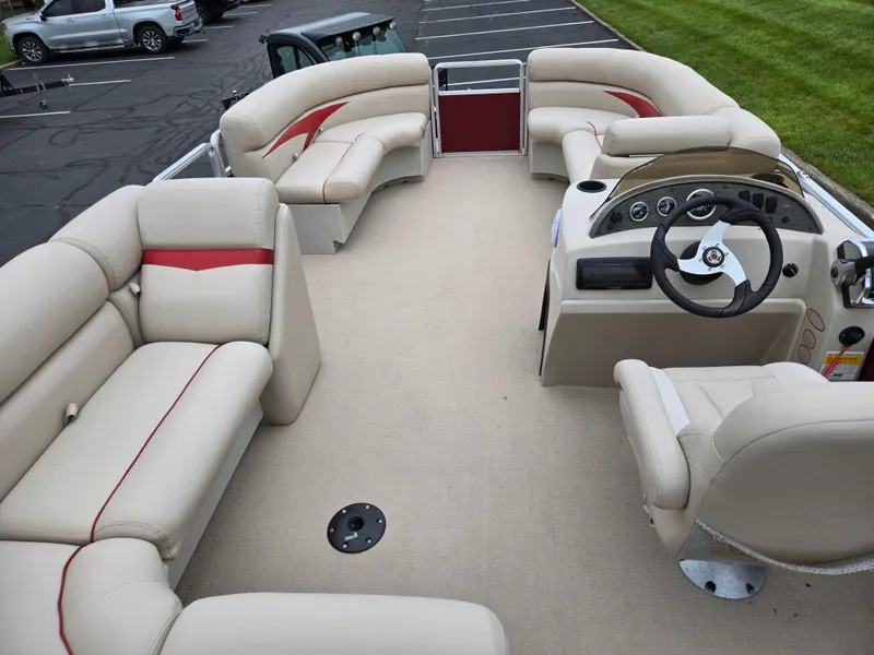 Slide: The Image of 2010 Harris FloteBote 200 Cruiser CX pontoon boat with beige seating and steering console. - 20