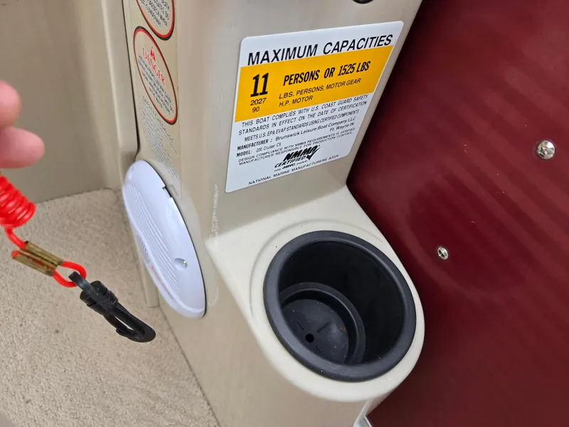 Slide: The Image of 2010 Harris FloteBote 200 Cruiser CX capacity label, cup holder, and safety lanyard. - 22
