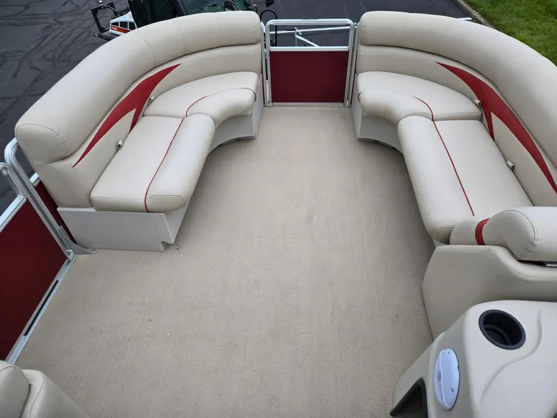 Slide: The Image of 2010 Harris FloteBote 200 Cruiser CX interior with beige seating and red accents. - 24