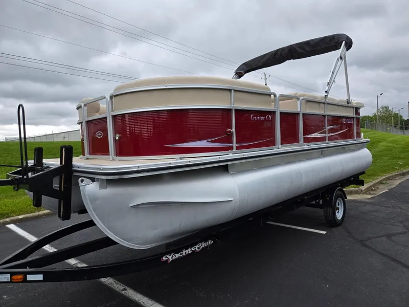 Slide: The Image of 2010 Harris FloteBote 200 Cruiser CX pontoon boat on trailer, red and beige design. - 5