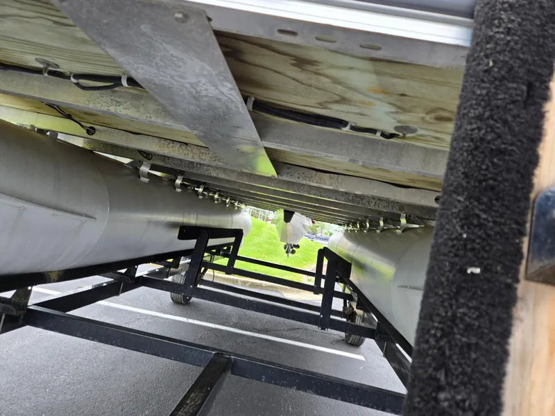 Slide: The Image of Underneath view of a 2010 Harris FloteBote 200 Cruiser CX pontoon boat on a trailer. - 7