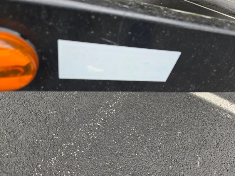 Slide: The Image of Close-up of a Harris FloteBote 200 Cruiser CX 2010 trailer detail with orange reflector. - 8