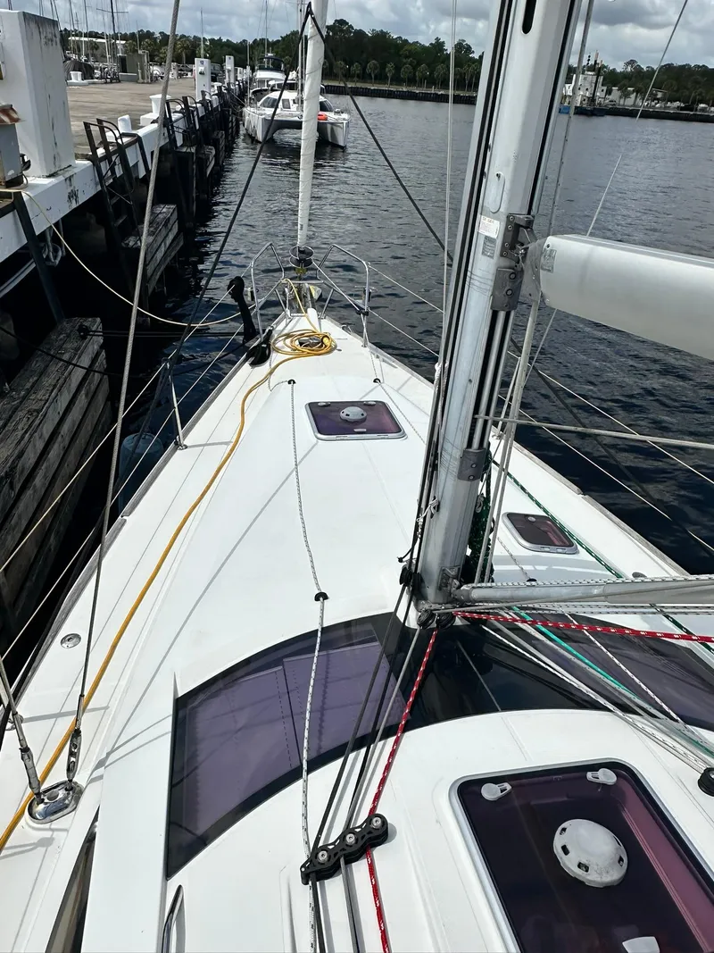 Slide: The Image of 2011 Jeanneau Sun Odyssey 45 DS sailboat docked at marina, view of deck and rigging. - 12