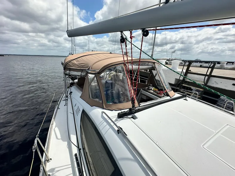 Slide: The Image of 2011 Jeanneau Sun Odyssey 45 DS sailboat docked on a calm, cloudy day. - 16