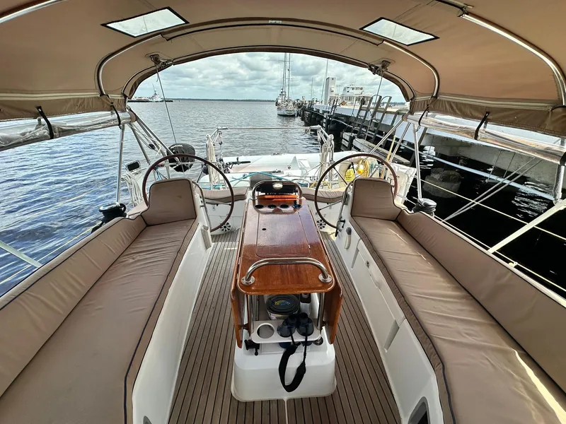 Slide: The Image of 2011 Jeanneau Sun Odyssey 45 DS cockpit with dual steering wheels and spacious seating. - 18