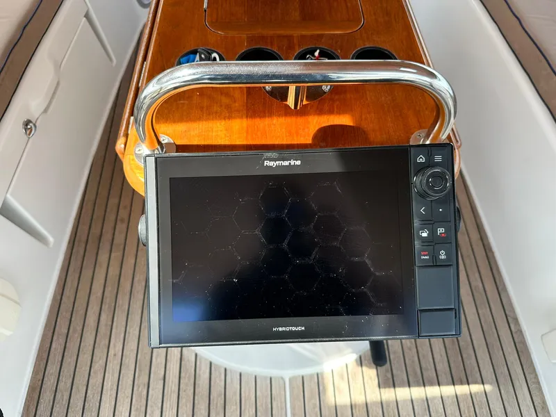Slide: The Image of Raymarine navigation system on Jeanneau Sun Odyssey 45 DS, 2011 model, with wooden cockpit details. - 21