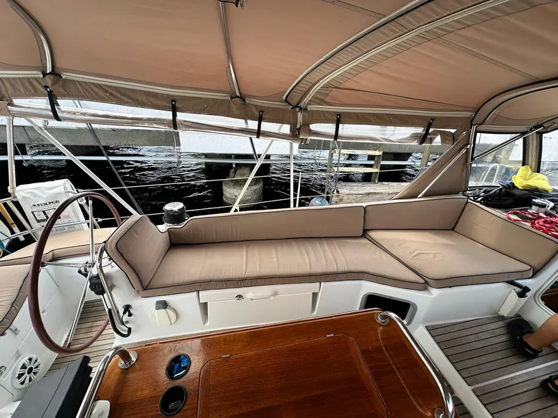 Slide: The Image of Spacious cockpit of 2011 Jeanneau Sun Odyssey 45 DS sailboat with cushioned seating. - 32