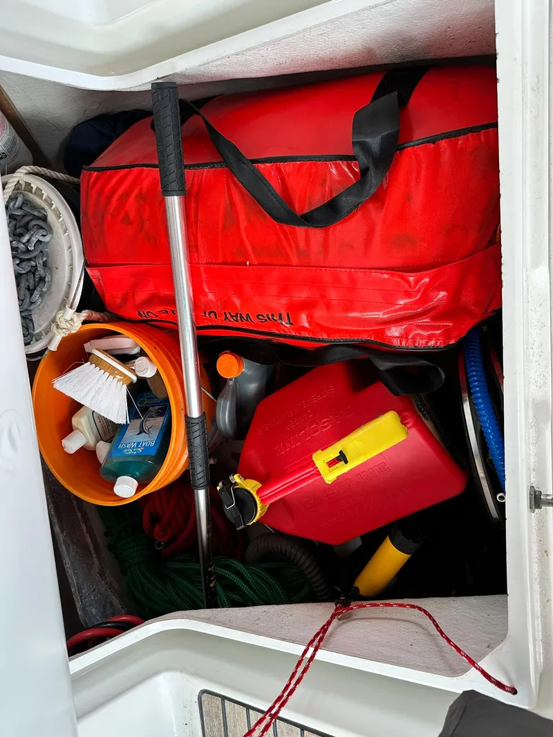 Slide: The Image of Storage compartment on a 2011 Jeanneau Sun Odyssey 45 DS with boating essentials. - 34