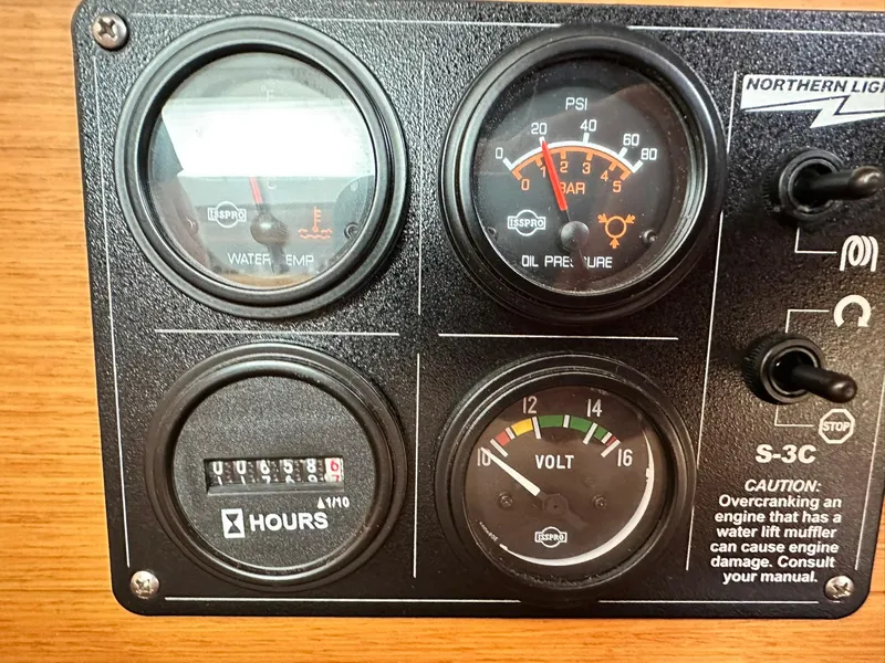 Slide: The Image of Instrument panel of a 2011 Jeanneau Sun Odyssey 45 DS sailboat, showing gauges and controls. - 35