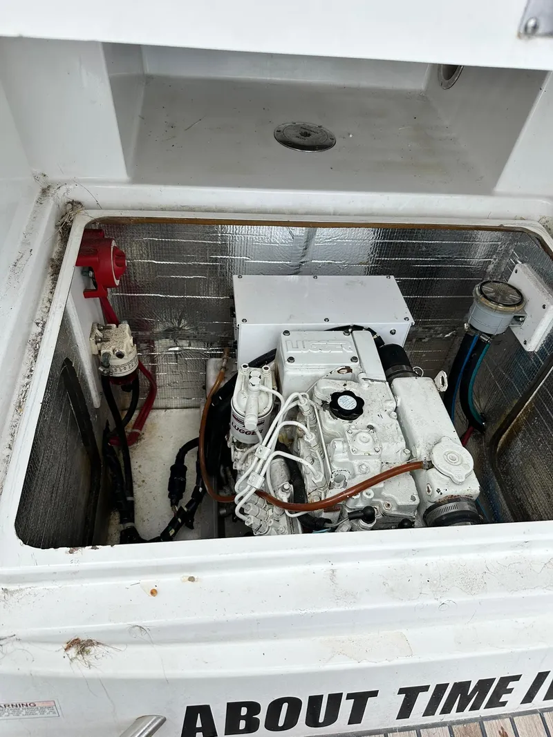 Slide: The Image of Engine compartment of 2011 Jeanneau Sun Odyssey 45 DS sailboat, showcasing mechanical components. - 38