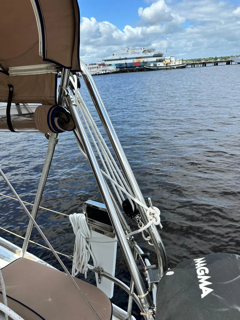 Slide: The Image of Jeanneau Sun Odyssey 45 DS sailboat docked near a harbor, 2011 model. - 39