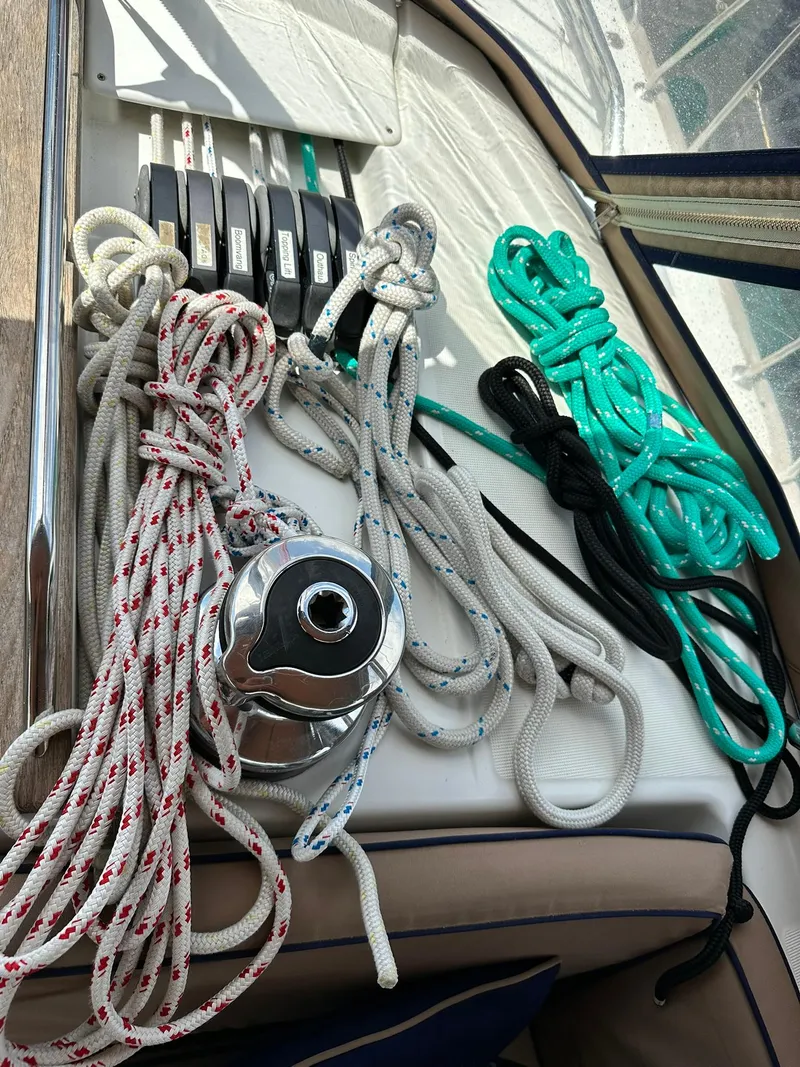 Slide: The Image of Ropes and winch on Jeanneau Sun Odyssey 45 DS, 2011 model sailboat deck. - 42