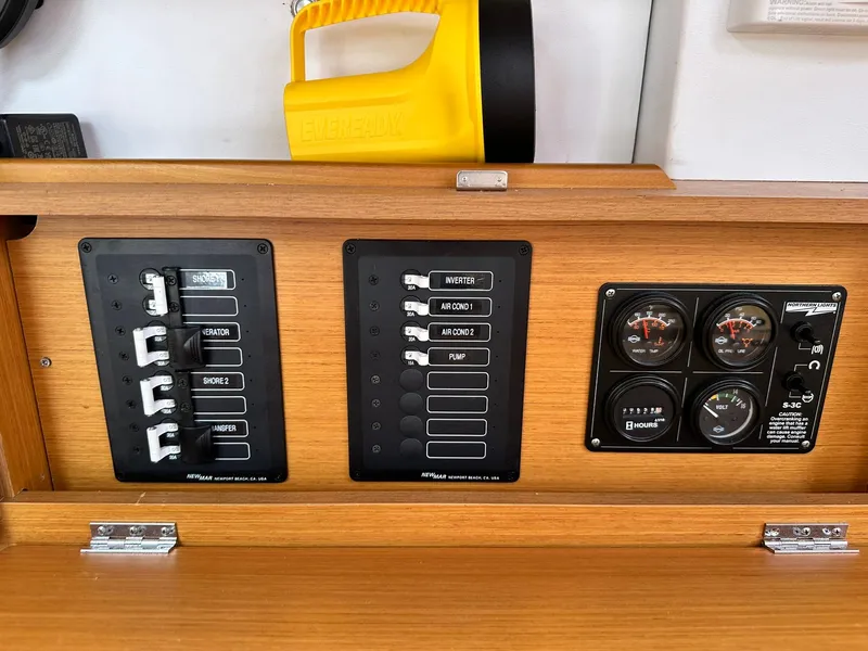 Slide: The Image of Control panel of 2011 Jeanneau Sun Odyssey 45 DS sailboat with switches and gauges. - 44