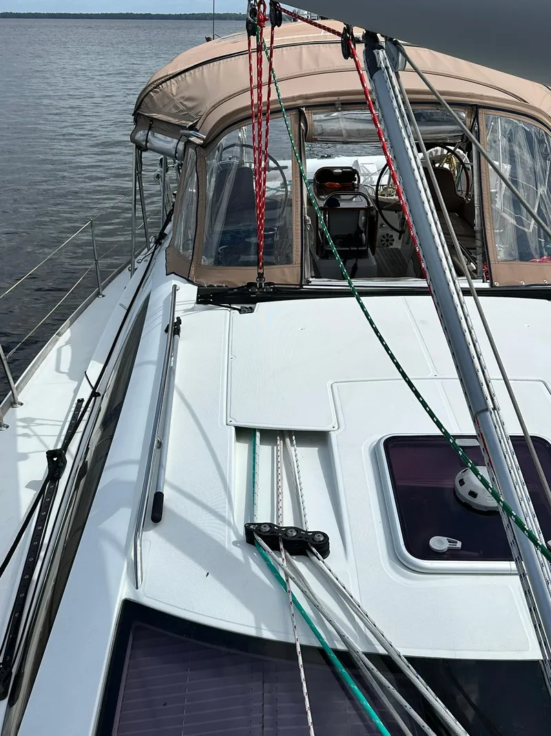 Slide: The Image of 2011 Jeanneau Sun Odyssey 45 DS sailboat deck with ropes and cockpit view. - 8