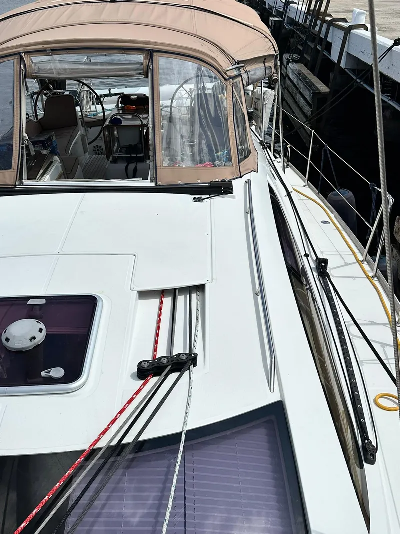 Slide: The Image of 2011 Jeanneau Sun Odyssey 45 DS sailboat with beige canopy and deck view. - 9