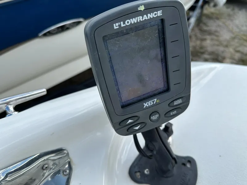 Slide: The Image of Lowrance X67c fishfinder on 2012 Hurricane SunDeck 237 OB boat dashboard. - 13