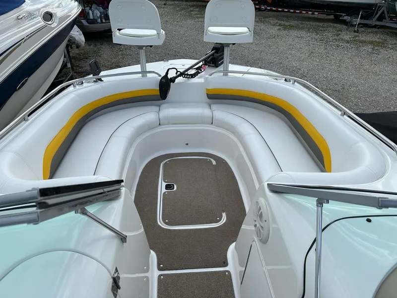 Slide: The Image of 2012 Hurricane SunDeck 237 OB boat interior with seating and storage. - 7
