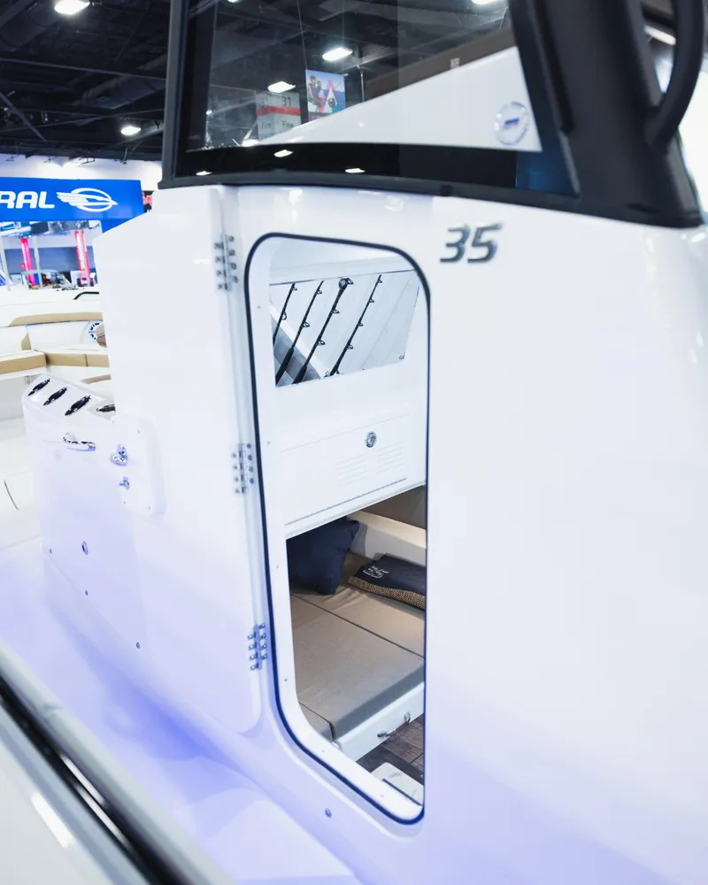 Slide: The Image of 2026 Regulator 35 boat interior, showcasing sleek design and modern features at a boat show. - 14