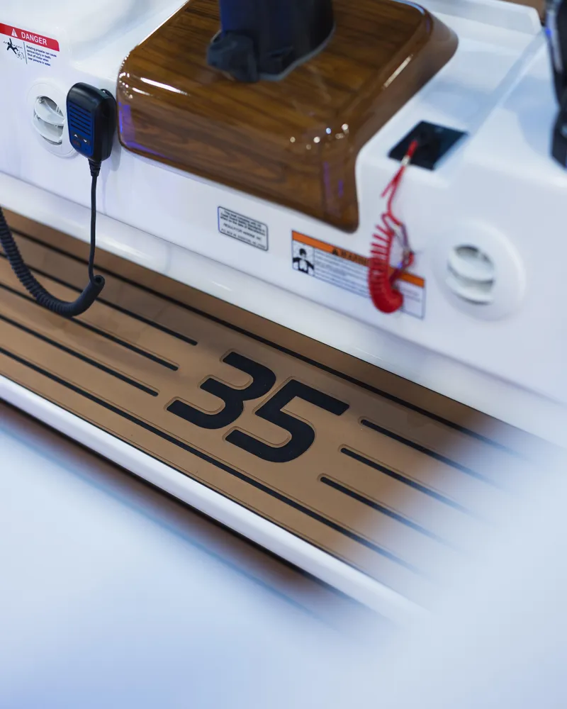 Slide: The Image of 2026 Regulator 35 boat interior with control panel and safety features. - 15