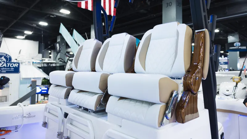 Slide: The Image of Luxury seating on 2026 Regulator 35 boat at a marine exhibition. - 7