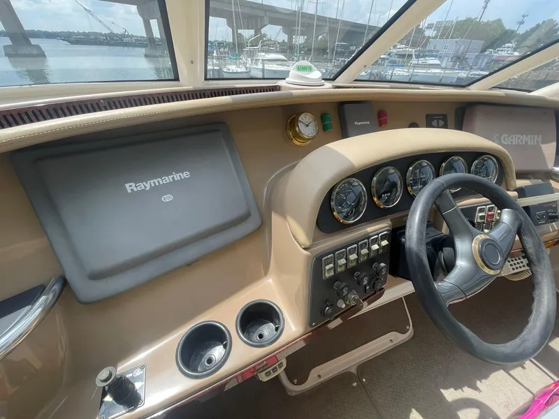 Slide: The Image of Helm of 2000 Carver 506 Motor Yacht with Raymarine and Garmin navigation systems. - 33