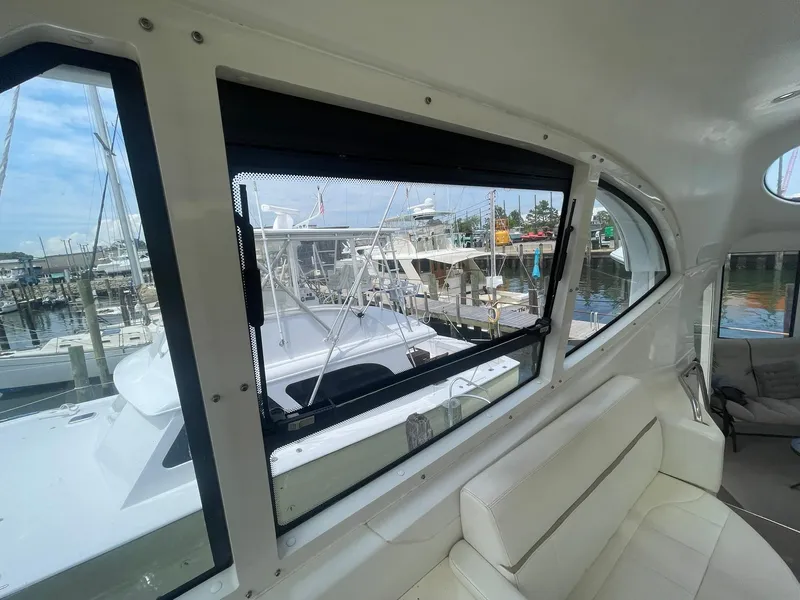 Slide: The Image of Interior view of 2000 Carver 506 Motor Yacht with marina backdrop. - 37