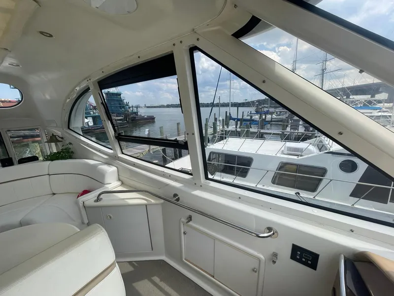 Slide: The Image of Interior view of 2000 Carver 506 Motor Yacht with marina backdrop. - 38