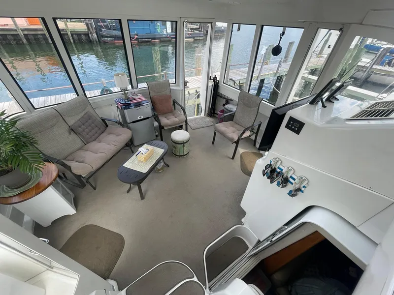 Slide: The Image of Interior of 2000 Carver 506 Motor Yacht with seating and waterfront view. - 39