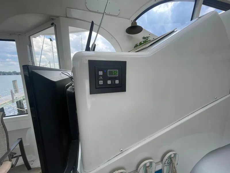 Slide: The Image of Control panel on 2000 Carver 506 Motor Yacht, with scenic water view. - 43